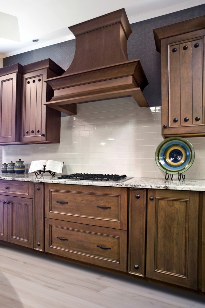 Inspiration for a traditional kitchen/diner in Other with medium wood cabinets and white splashback.