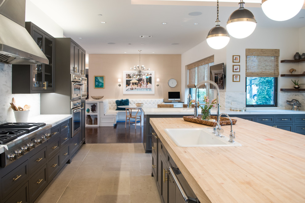 Inspiration for a large traditional l-shaped kitchen/diner in Dallas with a built-in sink, beaded cabinets, grey cabinets, marble worktops, white splashback, limestone flooring, an island, beige floors, stone slab splashback and stainless steel appliances.