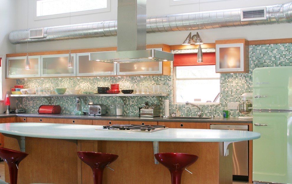 Example of a mid-century modern l-shaped open concept kitchen design in Dallas with an undermount sink, flat-panel cabinets, medium tone wood cabinets, concrete countertops, multicolored backsplash and stainless steel appliances