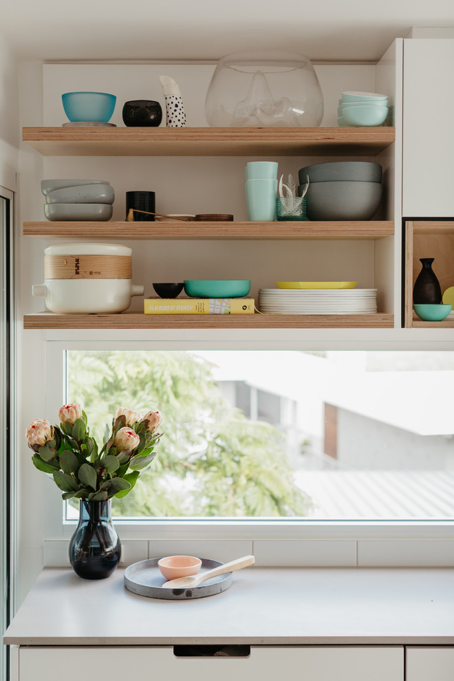Mittelgroße Skandinavische Wohnküche in L-Form mit Betonarbeitsplatte, Kücheninsel und grauer Arbeitsplatte in Sydney