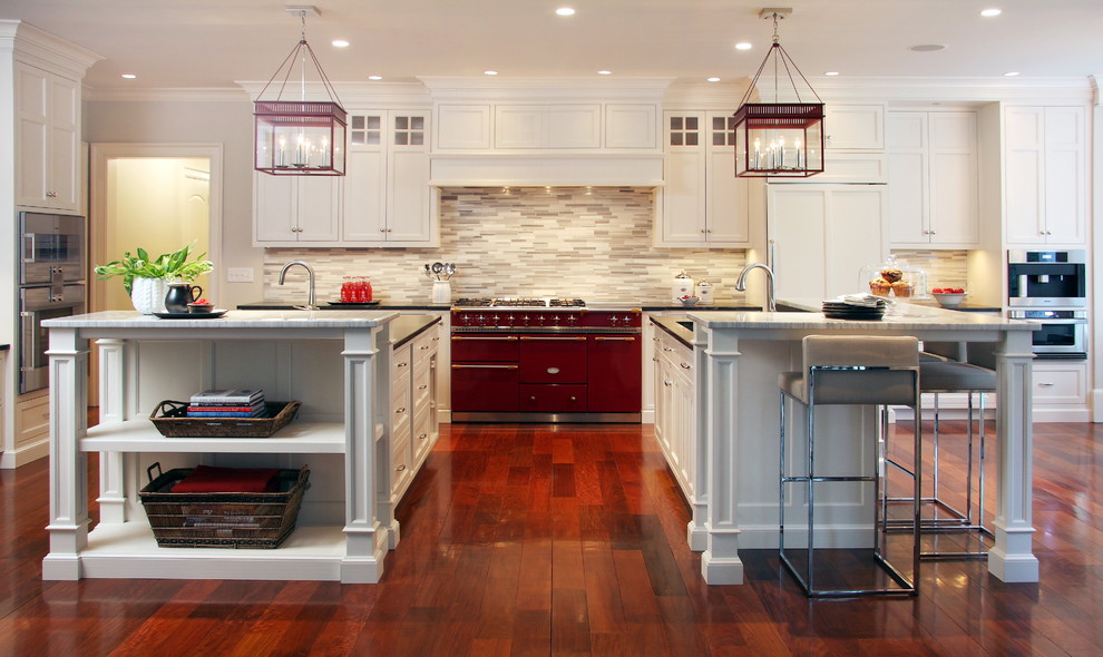 Photo of a classic kitchen in New York with coloured appliances and multiple islands.