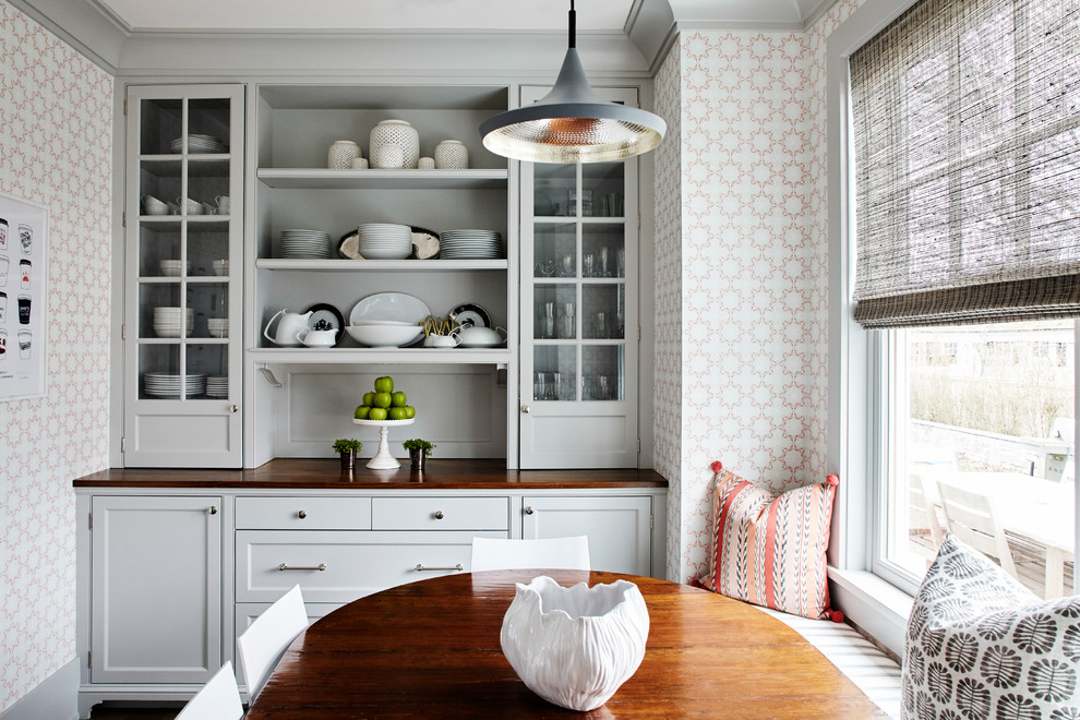 Elegant eat-in kitchen photo in New York with recessed-panel cabinets, gray cabinets, wood countertops and no island