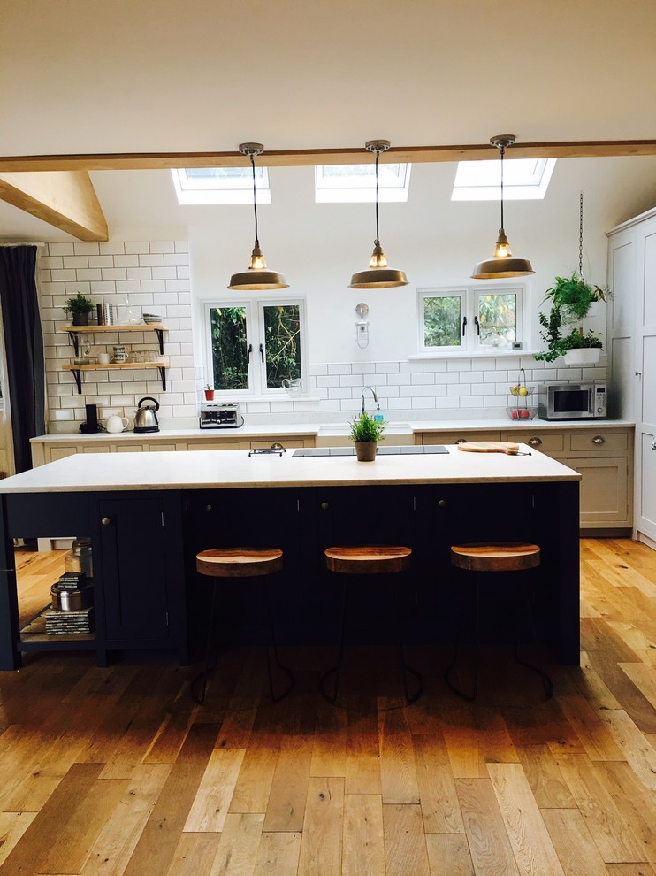 Dark blue kitchen with open plan shelves Modern Kitchen Surrey
