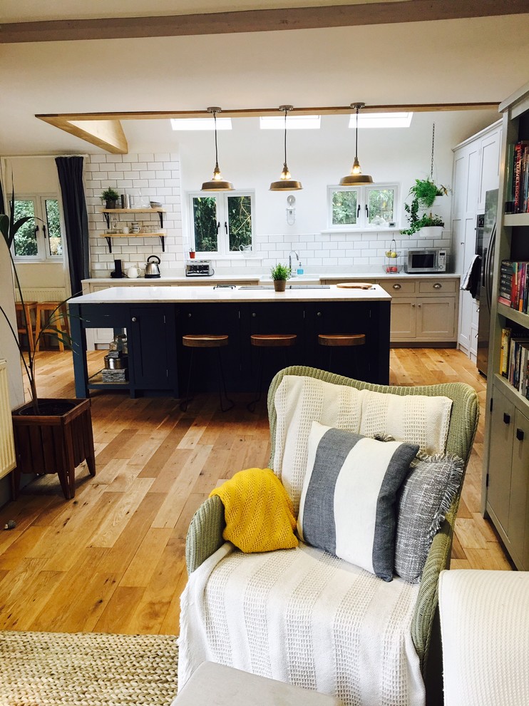 Dark blue kitchen with open plan shelves Modern Kitchen Surrey