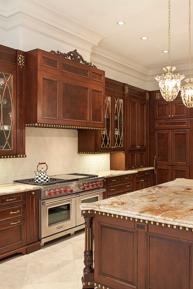 Example of a large classic u-shaped eat-in kitchen design in Houston with raised-panel cabinets, granite countertops, beige backsplash, ceramic backsplash, stainless steel appliances and an island
