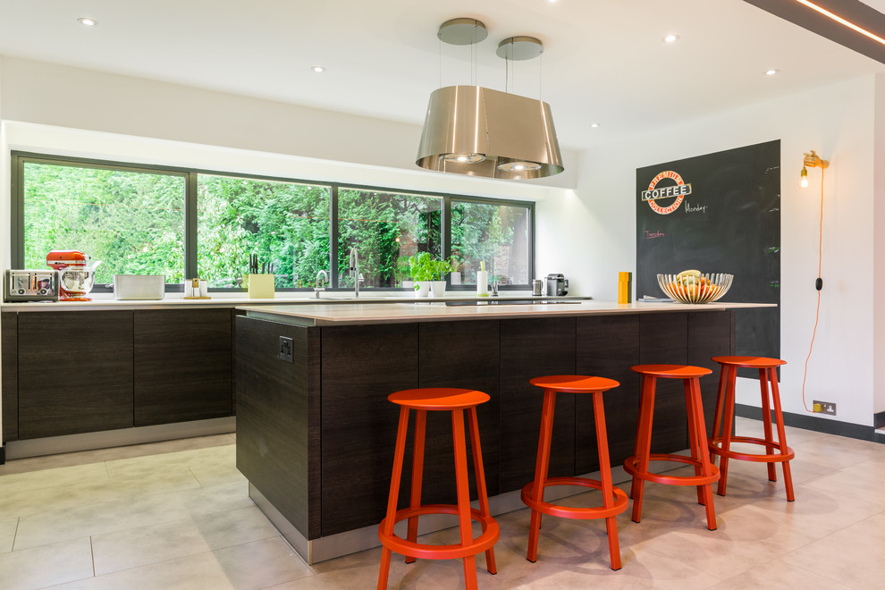 Design ideas for a large modern kitchen in London with black cabinets, an island and white worktops.