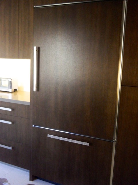 Dark wood modern kitchen with stainless steel Wolf appliances