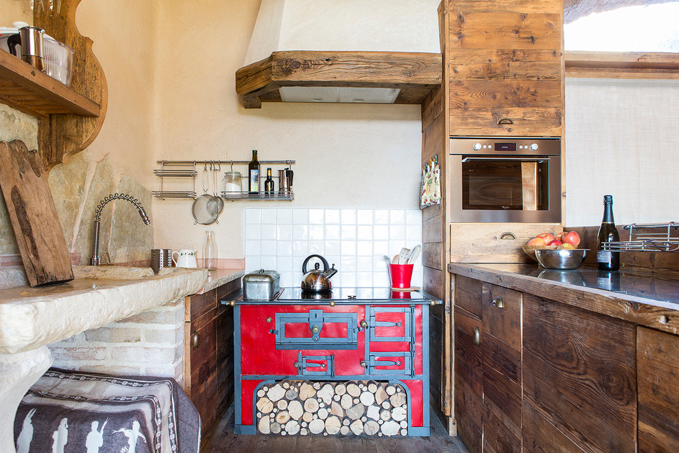 This is an example of a rustic u-shaped kitchen in Venice.