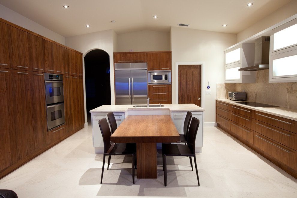This is an example of a contemporary kitchen in Miami with stainless steel appliances.