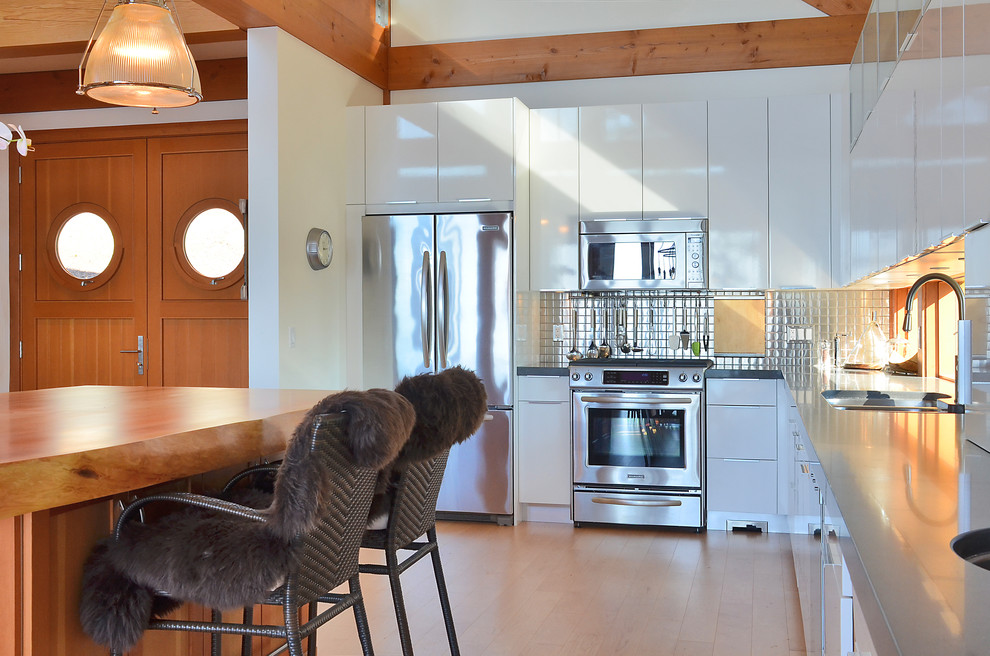 Example of a trendy kitchen design in Vancouver with stainless steel appliances