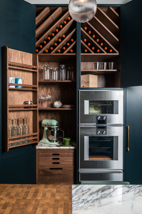 Unique Pantry Ideas: Navy Blue Cabinets with Wood Storage and Brass Hardware