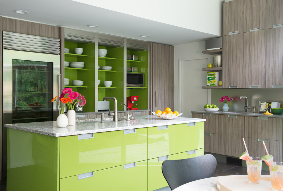 Inspiration for a contemporary l-shaped eat-in kitchen remodel in New York with flat-panel cabinets, gray cabinets, metallic backsplash, stainless steel appliances and an island