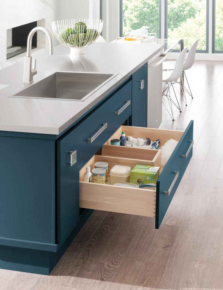 Mid-sized minimalist gray floor eat-in kitchen photo in Other with flat-panel cabinets, blue cabinets, stainless steel appliances and an island
