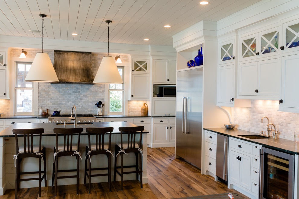 Design ideas for a large farmhouse open plan kitchen in Minneapolis with a submerged sink, beaded cabinets, turquoise cabinets, soapstone worktops, grey splashback, stainless steel appliances, medium hardwood flooring and an island.