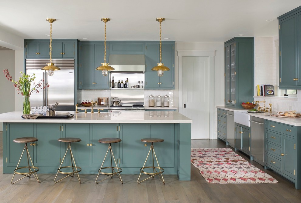 Transitional l-shaped dark wood floor kitchen photo in Seattle with a farmhouse sink, recessed-panel cabinets, blue cabinets, stainless steel appliances, an island and white backsplash