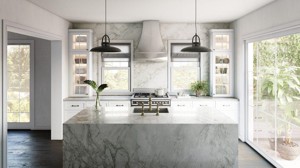 Example of a transitional kitchen design with white backsplash, an island and white countertops
