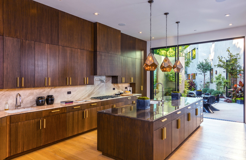 Inspiration for a contemporary galley light wood floor and brown floor kitchen remodel in Los Angeles with an undermount sink, flat-panel cabinets, dark wood cabinets, beige backsplash, stone slab backsplash, an island and beige countertops