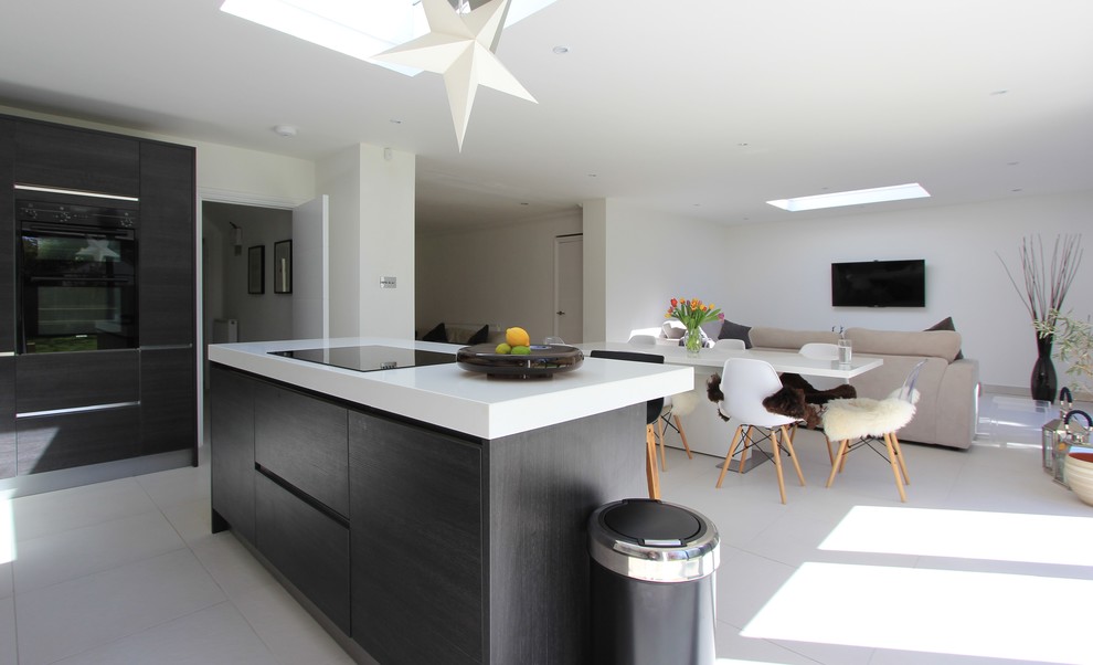 Design ideas for an expansive contemporary kitchen in Sussex with an integrated sink, porcelain flooring and an island.