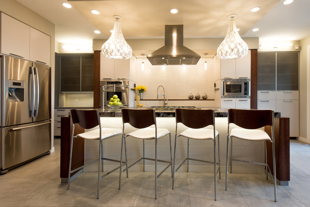 Mid-sized minimalist single-wall porcelain tile open concept kitchen photo in Denver with flat-panel cabinets, white cabinets, granite countertops, beige backsplash, an island, an undermount sink and stainless steel appliances