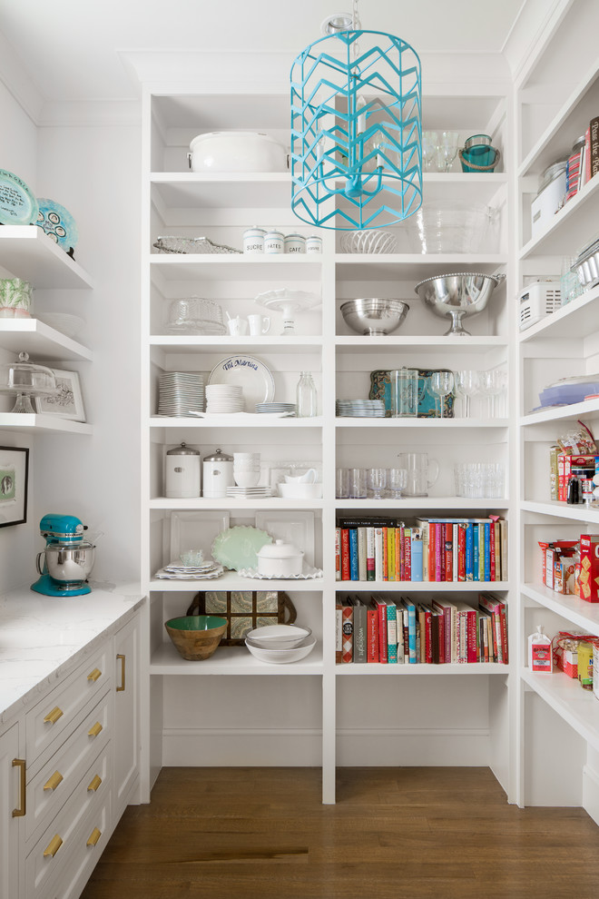Transitional u-shaped medium tone wood floor and brown floor kitchen pantry photo in Dallas with open cabinets, white cabinets and white countertops