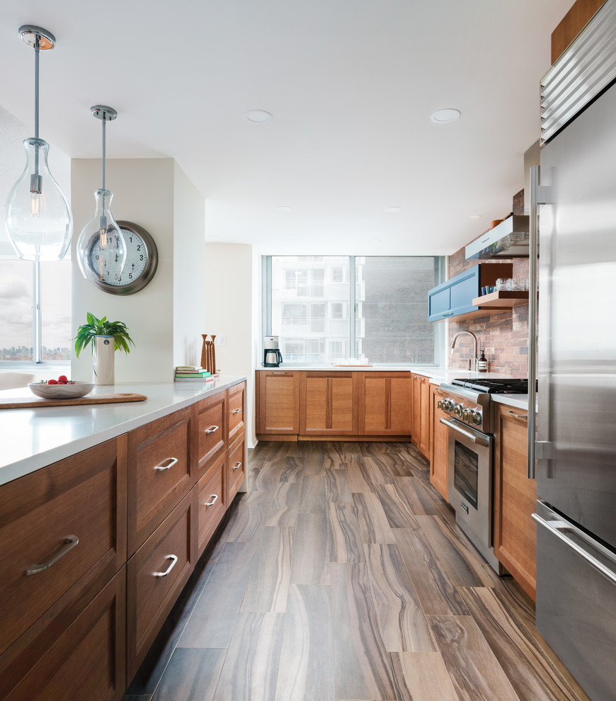 Classic kitchen in Seattle with shaker cabinets and medium wood cabinets.