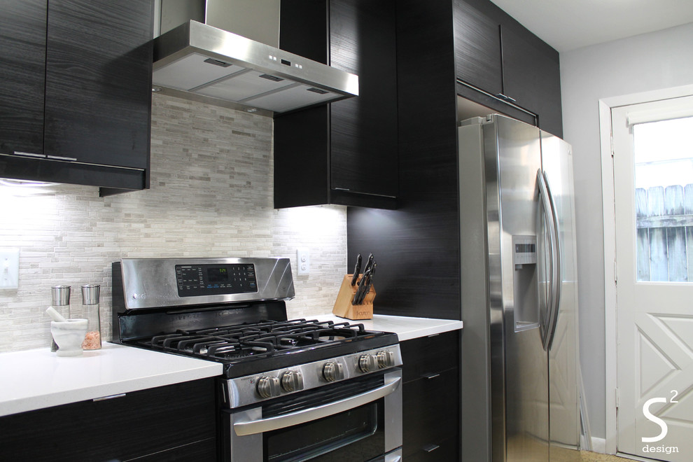 Example of a mid-sized minimalist galley eat-in kitchen design in Houston with a single-bowl sink, flat-panel cabinets, black cabinets, quartz countertops, gray backsplash, stone tile backsplash, stainless steel appliances and no island