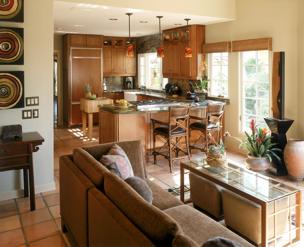 Bild på ett stort tropiskt kök, med en rustik diskho, släta luckor, skåp i mörkt trä, marmorbänkskiva, flerfärgad stänkskydd, stänkskydd i sten, rostfria vitvaror, klinkergolv i keramik, en köksö och orange golv