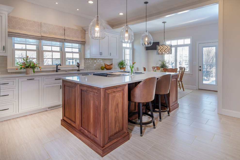 Inspiration for a large transitional u-shaped ceramic tile and beige floor eat-in kitchen remodel in Charlotte with beaded inset cabinets, white cabinets, solid surface countertops, beige backsplash, glass tile backsplash, stainless steel appliances, an island and gray countertops