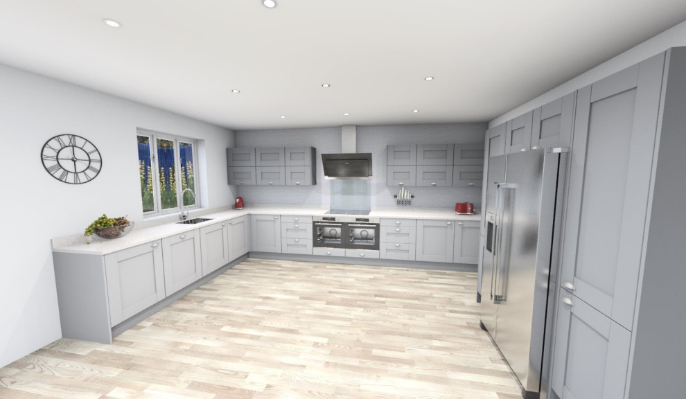 Inspiration for a kitchen/diner in Cambridgeshire with shaker cabinets, quartz worktops, integrated appliances, an island and white worktops.