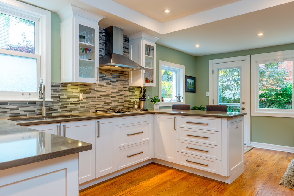 Example of a transitional kitchen design in Ottawa with shaker cabinets and white cabinets