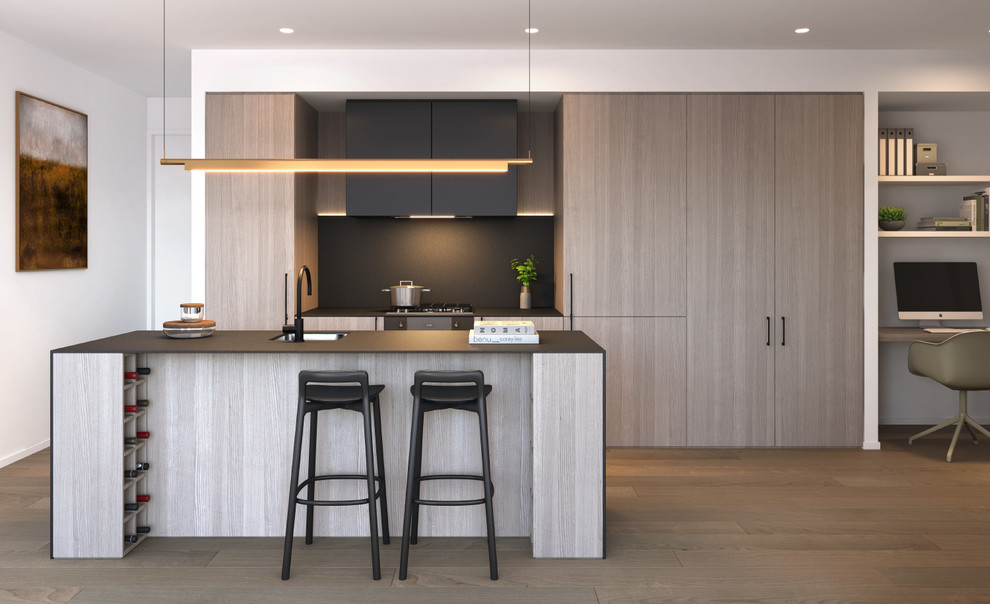 Photo of a medium sized contemporary galley kitchen in Miami with a submerged sink, flat-panel cabinets, light wood cabinets, glass worktops, black splashback, integrated appliances, medium hardwood flooring, an island and brown floors.