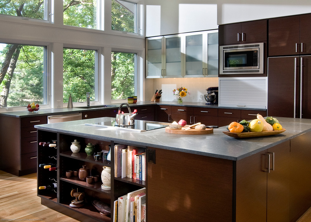 Inspiration for a contemporary l-shaped kitchen remodel in Denver with flat-panel cabinets and dark wood cabinets