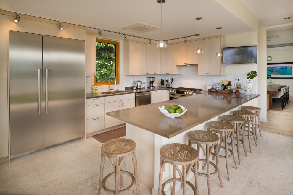 Inspiration for a contemporary u-shaped beige floor kitchen remodel in Hawaii with flat-panel cabinets, light wood cabinets, quartzite countertops, white backsplash, gray countertops, an undermount sink, stainless steel appliances and a peninsula