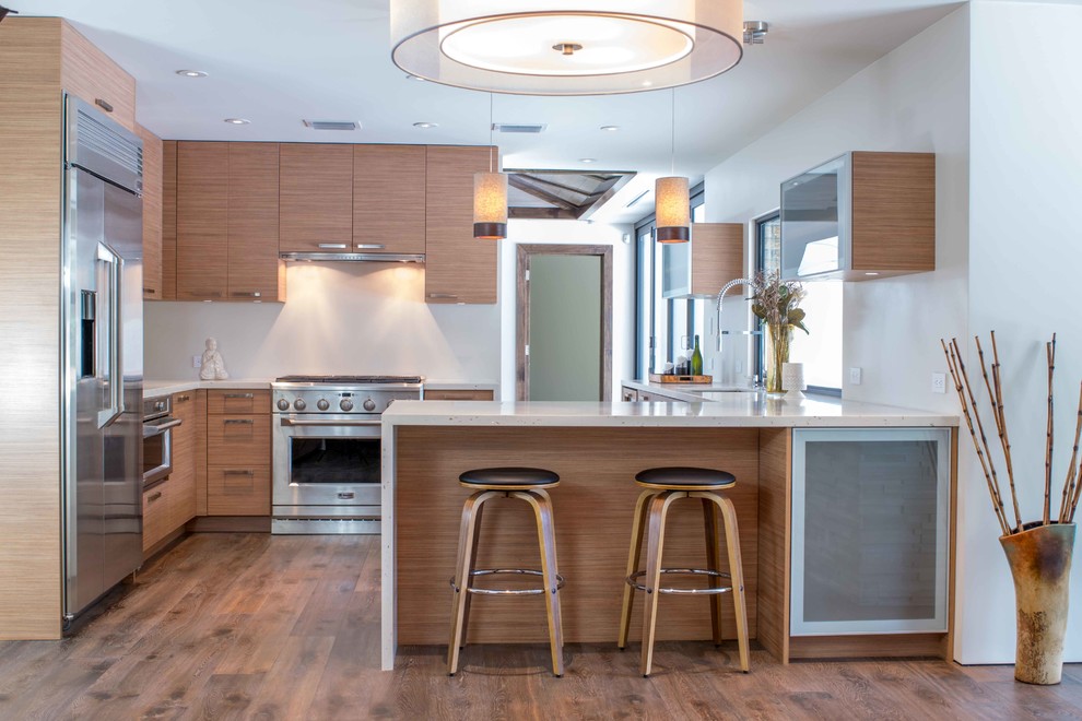 Inspiration for a mid-sized contemporary u-shaped medium tone wood floor and brown floor eat-in kitchen remodel in Miami with flat-panel cabinets, medium tone wood cabinets, quartz countertops, an undermount sink, stainless steel appliances and no island