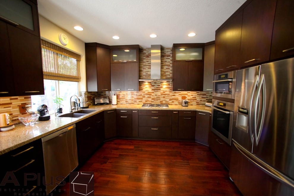 Eat-in kitchen - mid-sized modern l-shaped dark wood floor eat-in kitchen idea in Orange County with a double-bowl sink, flat-panel cabinets, dark wood cabinets, quartz countertops, multicolored backsplash, mosaic tile backsplash, stainless steel appliances and no island