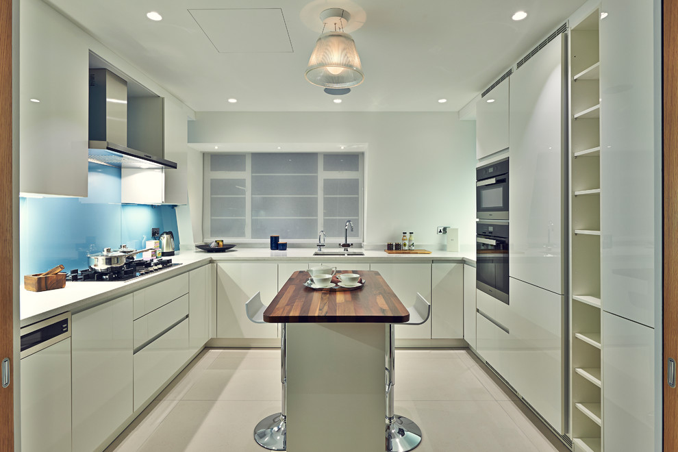 This is an example of a small contemporary kitchen in Surrey.