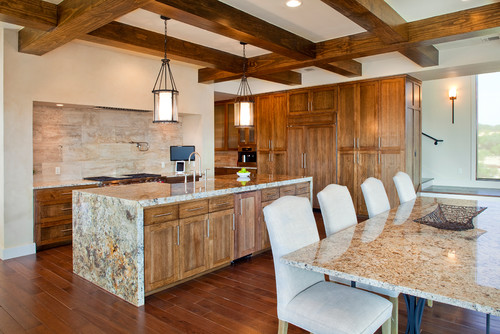 Mediterranean kitchen with granite island countertops 