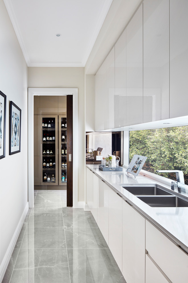Photo of a contemporary grey and cream kitchen in Melbourne.