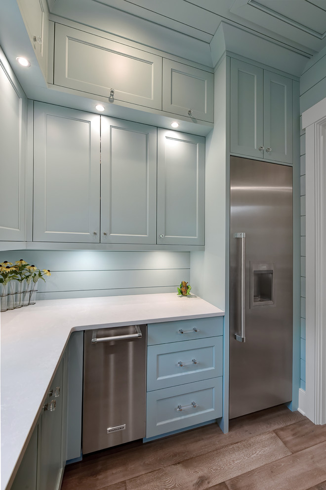 Beach style kitchen pantry in Charleston with stainless steel appliances.
