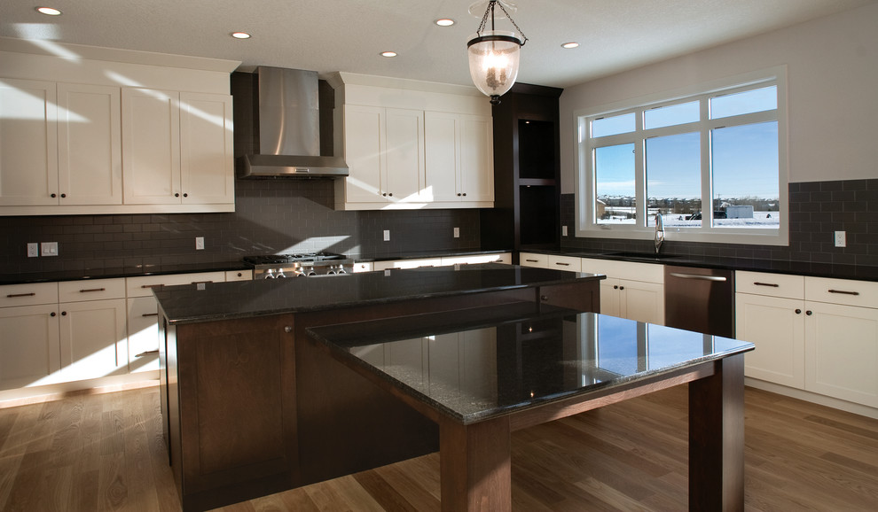 Transitional kitchen photo in Calgary with recessed-panel cabinets, white cabinets and stainless steel appliances