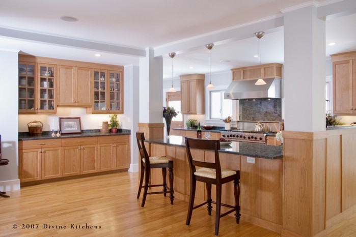 Example of a mid-sized minimalist u-shaped light wood floor eat-in kitchen design in Boston with an undermount sink, shaker cabinets, light wood cabinets, granite countertops, gray backsplash, stone slab backsplash, stainless steel appliances and a peninsula