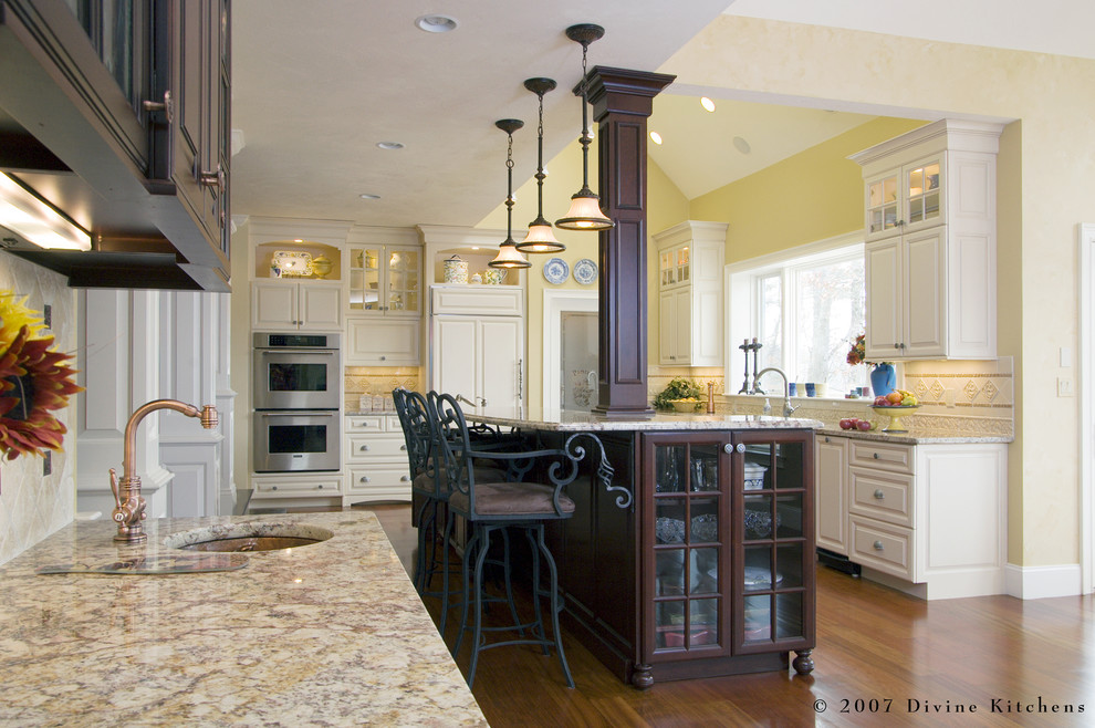 Eat-in kitchen - large traditional l-shaped dark wood floor eat-in kitchen idea in Boston with a double-bowl sink, beaded inset cabinets, dark wood cabinets, granite countertops, beige backsplash, ceramic backsplash, stainless steel appliances and an island
