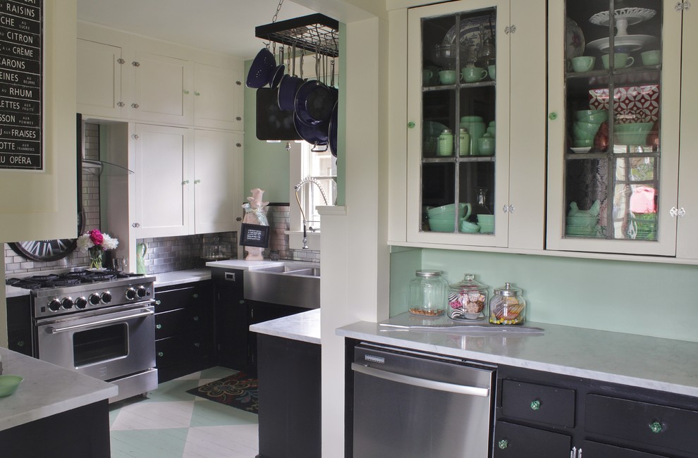 Inspiration for a medium sized eclectic kitchen pantry in Seattle with a belfast sink, shaker cabinets, white cabinets, marble worktops, metallic splashback, metal splashback, stainless steel appliances and painted wood flooring.
