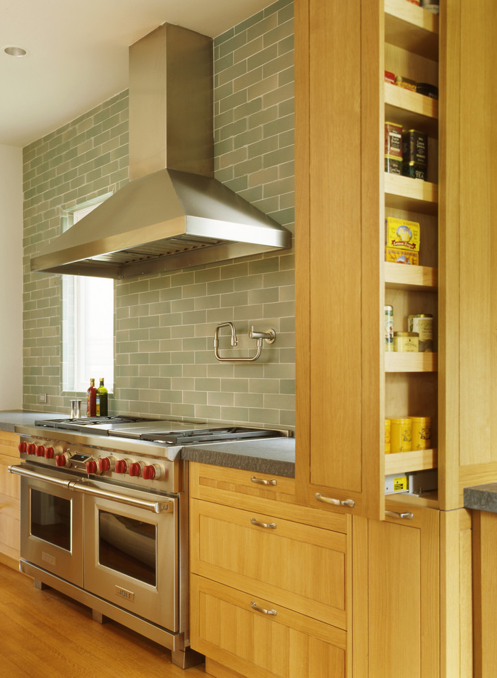 Ornate kitchen photo in San Francisco with light wood cabinets and gray backsplash