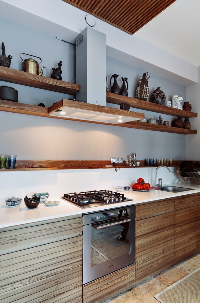 Trendy single-wall kitchen photo in Moscow with a drop-in sink, light wood cabinets and stainless steel appliances