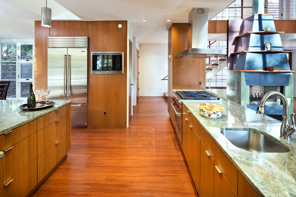 Example of a large trendy u-shaped dark wood floor and brown floor open concept kitchen design in DC Metro with an undermount sink, flat-panel cabinets, medium tone wood cabinets, granite countertops, stainless steel appliances and an island