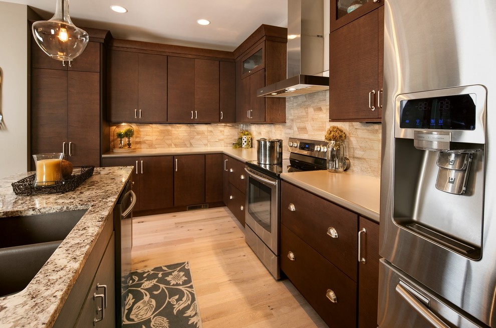 Eclectic l-shaped kitchen photo in Other with flat-panel cabinets, stainless steel appliances and an island