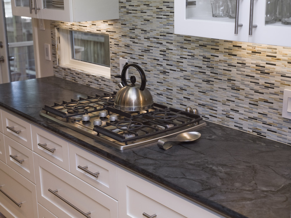 Example of a classic kitchen design in Austin with soapstone countertops