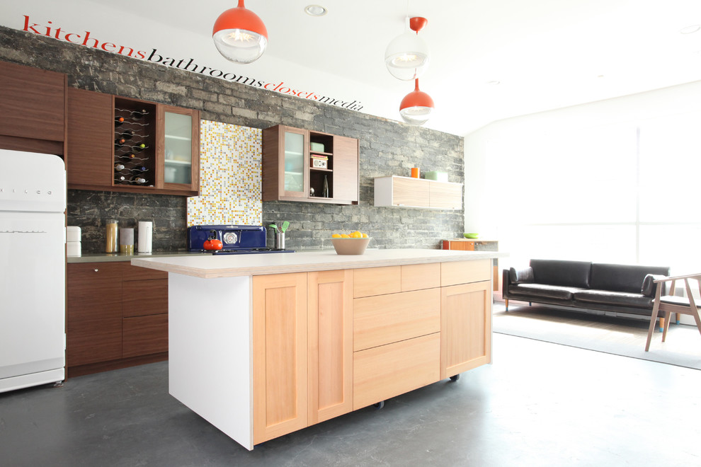 Inspiration for a medium sized contemporary galley kitchen/diner in Los Angeles with a submerged sink, shaker cabinets, medium wood cabinets, laminate countertops, multi-coloured splashback, glass tiled splashback, coloured appliances and concrete flooring.