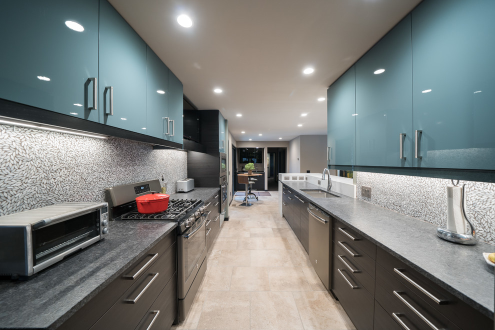 Photo of a medium sized modern galley kitchen/diner in Grand Rapids with a submerged sink, flat-panel cabinets, turquoise cabinets, granite worktops, grey splashback, mosaic tiled splashback, coloured appliances, ceramic flooring, a breakfast bar, beige floors and grey worktops.